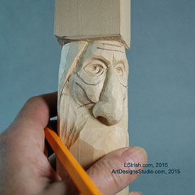 carving the wrinkles of a wood spirit face