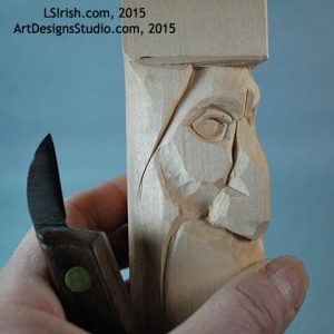 carving the eye lids of a wood spirit