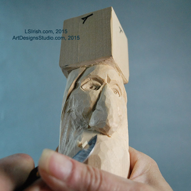 carving the mustache of a wood spirit