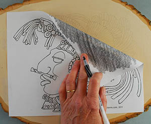 You can trace your pattern using carbon paper, graphite paper, or a pencil rubbing.