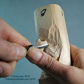 using a round gouge in wood carving